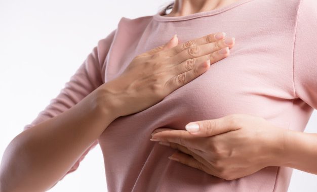a lady showing her breast side